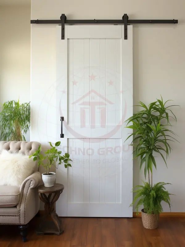 "Double barn doors seamlessly integrate with the wooden ceiling beams."