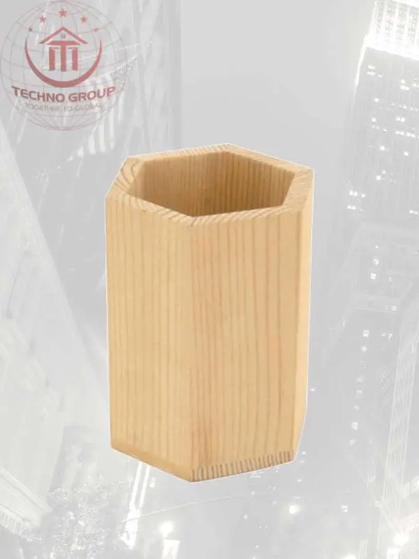"Stylish hexagonal pencil pot made of wood, providing a chic and organized solution for your desk essentials."