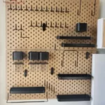 "Versatile pegboard wall shelf made from wood, allowing customizable storage and organization."